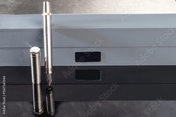 Obraz Fountain pen with box on dark gray background. Stationery branded items