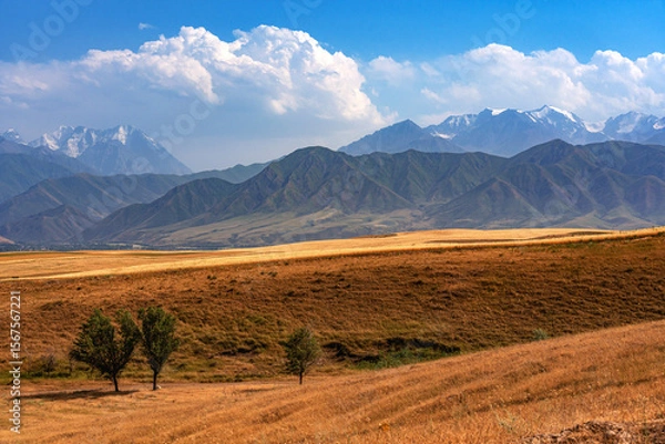 Fototapeta Bright colorful beautiful mountain landscape with mountains, clouds, fields and hills.