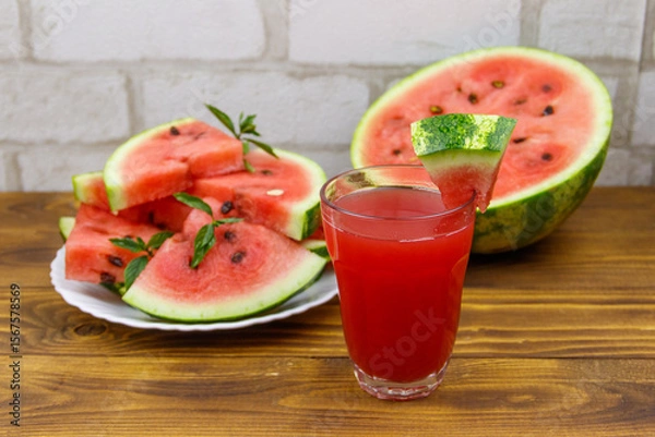 Obraz Glass of fresh watermelon juice on a wooden table