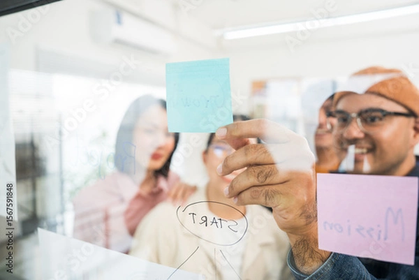 Obraz Asian business start up freelance people team analyzing statistics financial. Group Team of businesspeople man and woman Meeting Conference Discussion various topic Corporate Concept in office.