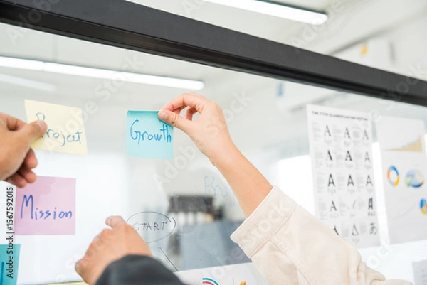 Obraz Asian business start up freelance people team analyzing statistics financial. Group Team of businesspeople man and woman Meeting Conference Discussion various topic Corporate Concept in office.