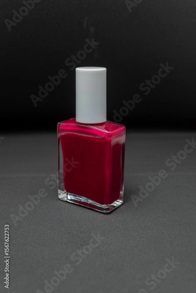 Obraz Manicure set black background nail red light from front 