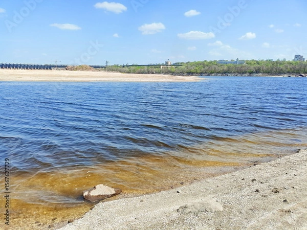 Fototapeta Amazing panorama of the sky blue reflected on the water surface of the Dnieper covered with small ripples.