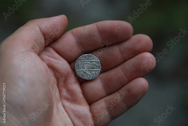 Fototapeta Medieval silver coin one rupee of India in hand