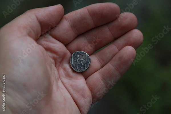 Fototapeta Medieval silver coin one rupee of India in hand