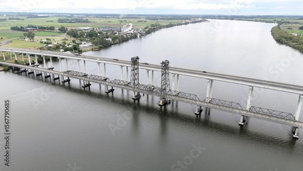 Fototapeta A stunning Aerial View of Pacific Highway Harwood Bridge crosses the Clarence River under a cloudy sky in the Northern Rivers region of New South Wales, Australia 