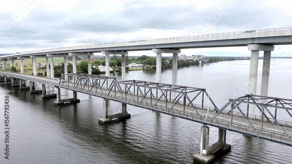 Fototapeta A stunning Aerial View of Pacific Highway Harwood Bridge crosses the Clarence River under a cloudy sky in the Northern Rivers region of New South Wales, Australia 