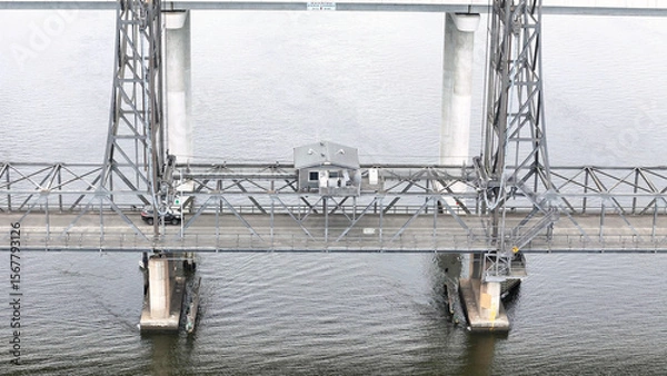 Fototapeta A stunning Aerial View of Pacific Highway Harwood Bridge crosses the Clarence River under a cloudy sky in the Northern Rivers region of New South Wales, Australia 