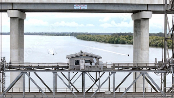 Fototapeta A stunning Aerial View of Pacific Highway Harwood Bridge crosses the Clarence River under a cloudy sky in the Northern Rivers region of New South Wales, Australia 