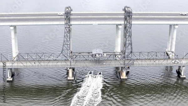 Fototapeta A stunning Aerial View of Pacific Highway Harwood Bridge crosses the Clarence River under a cloudy sky in the Northern Rivers region of New South Wales, Australia 