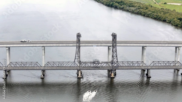 Fototapeta A stunning Aerial View of Pacific Highway Harwood Bridge crosses the Clarence River under a cloudy sky in the Northern Rivers region of New South Wales, Australia 