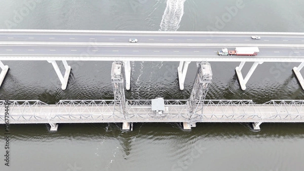 Fototapeta A stunning Aerial View of Pacific Highway Harwood Bridge crosses the Clarence River under a cloudy sky in the Northern Rivers region of New South Wales, Australia 