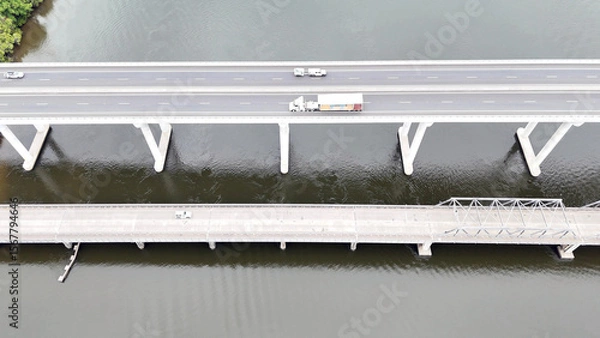 Fototapeta A stunning Aerial View of Pacific Highway Harwood Bridge crosses the Clarence River under a cloudy sky in the Northern Rivers region of New South Wales, Australia 