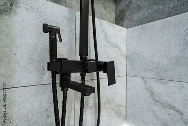 Fototapeta Discover the allure of a Modern Black Shower Faucet seamlessly integrated into a chic Minimalist Bathroom Design, featuring elegant and Stylish Grey Wall Tiles that elevate the overall aesthetic
