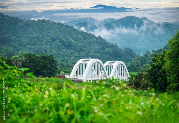 Fototapeta Tha Chomphu Railway Bridge in Lamphun Province Northern Thailand. It's a famous landmark View of the dam Lamphun