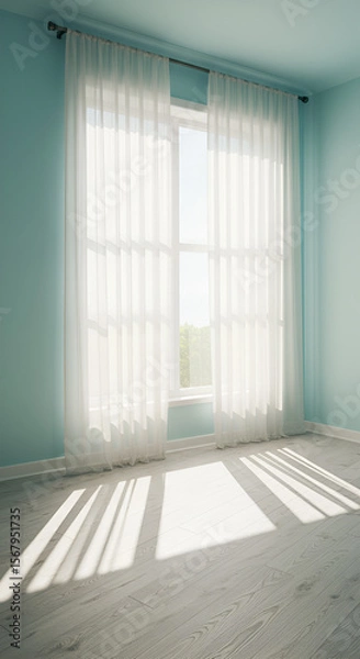 Fototapeta Sunlight streams through sheer white curtains in a light blue room.