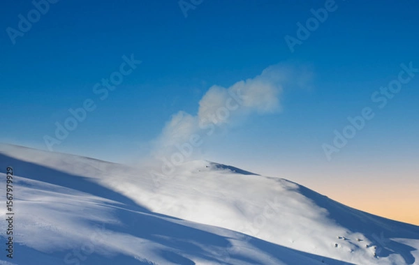 Obraz ends the day with a beautiful sunset in the high mountains among the snowy winter