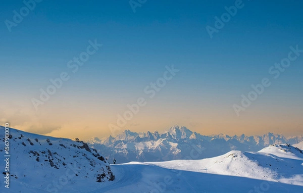 Obraz the sun sets behind the mountains on a beautiful winter day