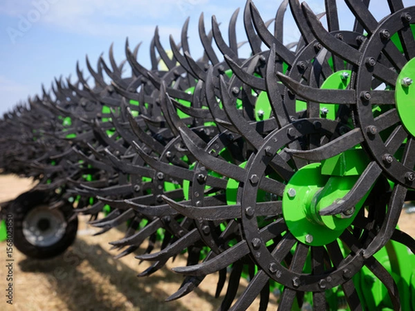 Fototapeta Close-up of a rotary harrow green color for processing an agricultural field.