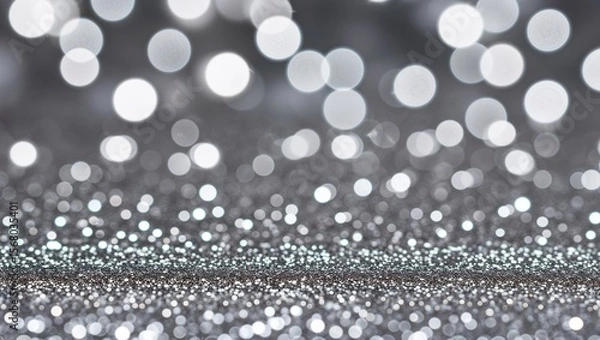 Fototapeta A dazzling silver bokeh background creates a magical ambiance.