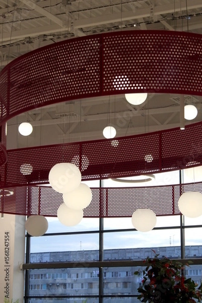 Fototapeta Ceiling with chandeliers in a shopping center.