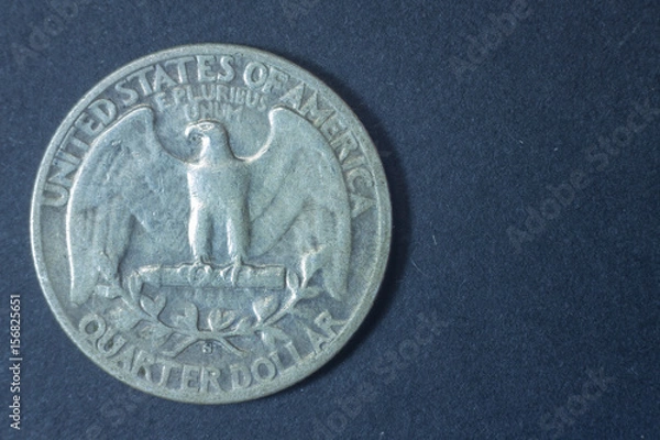 Fototapeta A quarter american dollar 1944 USA tail coin, vintage antique old, difficult and rare to find. Eagle e pluribus unum