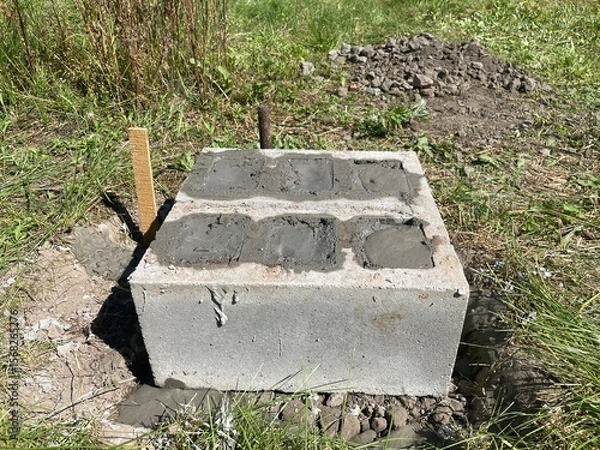 Fototapeta Foundation made of concrete cinder blocks