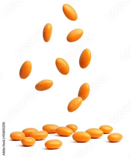 Obraz orange pills on white background