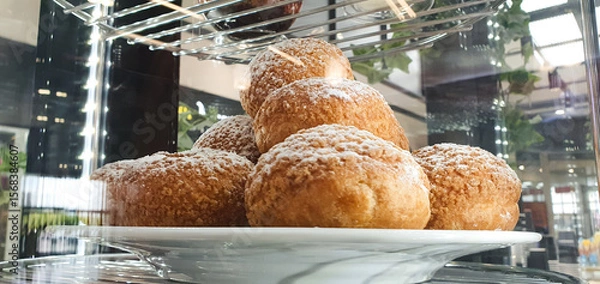 Obraz Custard cake, dessert bun Shu on display,flour product with cream, bakery.