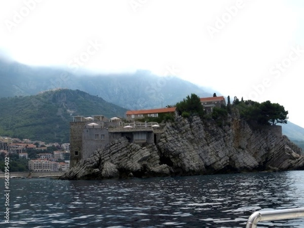 Obraz Exploring the Unique Architecture of Sveti Stefan Island Resort in Montenegro Amid Morning Mist
