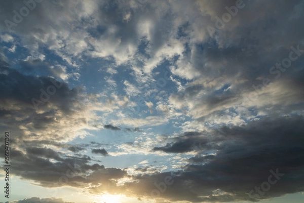 Fototapeta Beautiful bright sunset sky background with clouds.  Evening time.