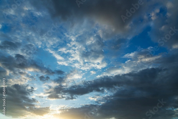 Fototapeta Beautiful bright sunset sky background with clouds.  Evening time.