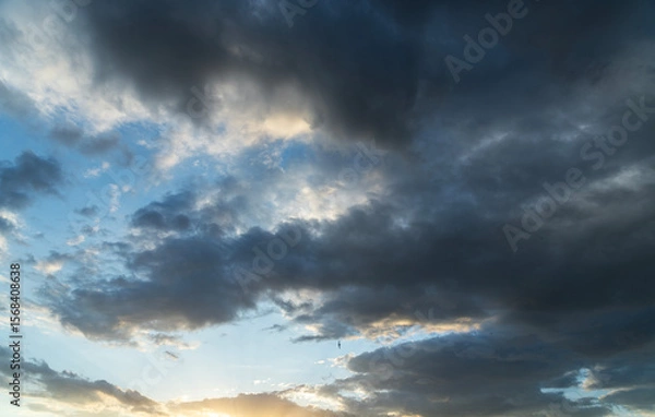 Fototapeta Beautiful bright sunset sky background with clouds.  Evening time.