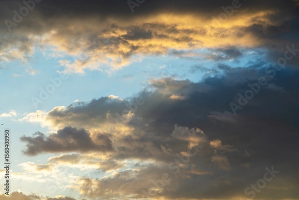 Fototapeta Beautiful bright sunset sky background with clouds.  Evening time.