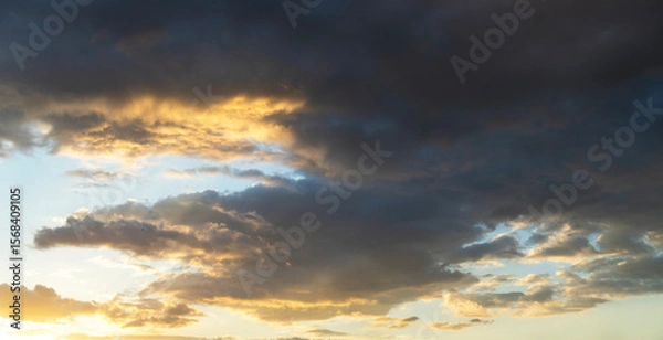 Fototapeta Beautiful bright sunset sky background with clouds.  Evening time.