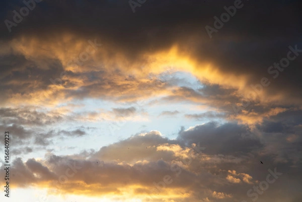 Fototapeta Beautiful bright sunset sky background with clouds.  Evening time.