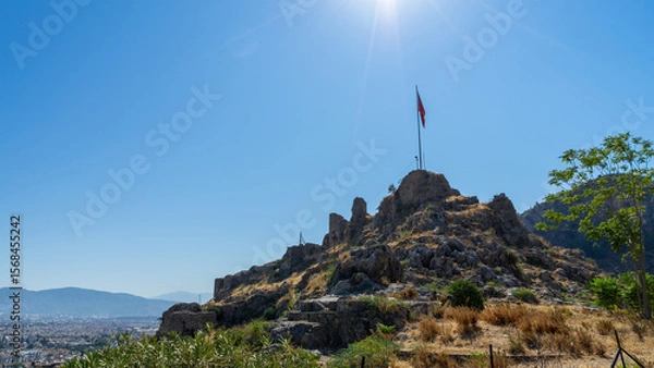Fototapeta Ruins and fragments of walls of medieval Crusader castle, built in XV century by Knights Hospitaller of Order of St. John on hill above city of Fethiye, Turkey