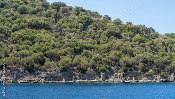 Fototapeta Gemiler Island or Saint Nicholas island located off coast of Turkey near city Fethiye or Oludeniz. Byzantine remains of several Greek churches. Gemile in Mediterranean Sea