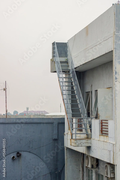 Obraz Multi-storey building roof with stairs