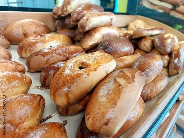 Obraz Freshly Baked Rolls Displayed in a Bakery at Midday