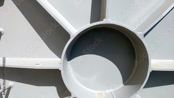 Obraz Flange Cover With Circular Opening Situated in Industrial Facility Under Bright Sunlight
