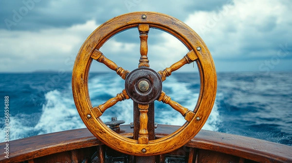 Fototapeta Close-up of a soaked wooden ship wheel glistening with rain, surrounded by ocean spray and turbulent skies. Symbol of navigation, perseverance, and stormy journeys. Maritime drama and adventure.

