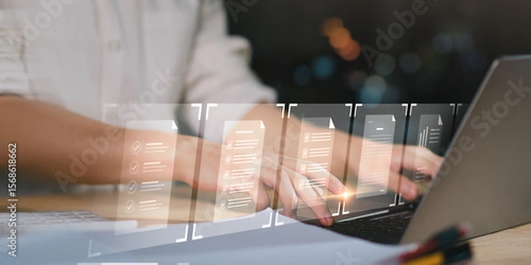 Fototapeta professional meticulously reviews multiple virtual documents,