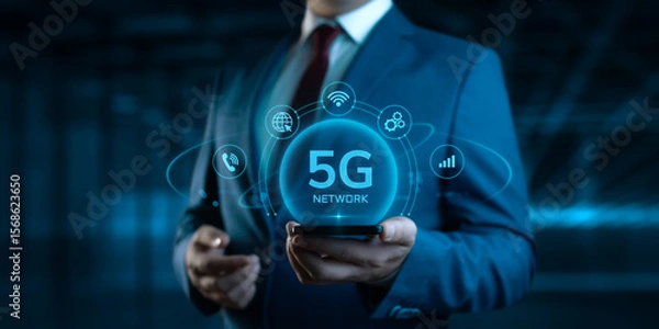 Fototapeta Businessman Holding Smartphone with 5G Network Icons on Screen. Business and Technology concept
