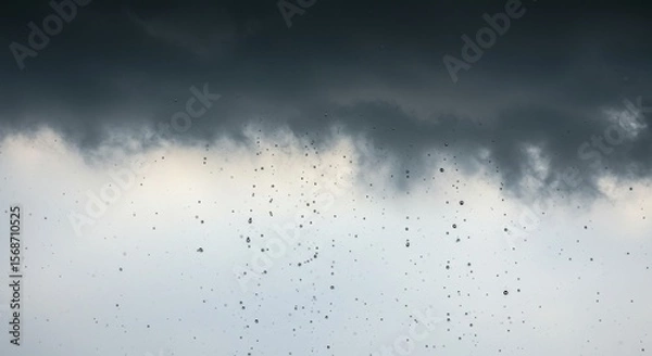 Fototapeta Rain falling from a dark, heavy cloud