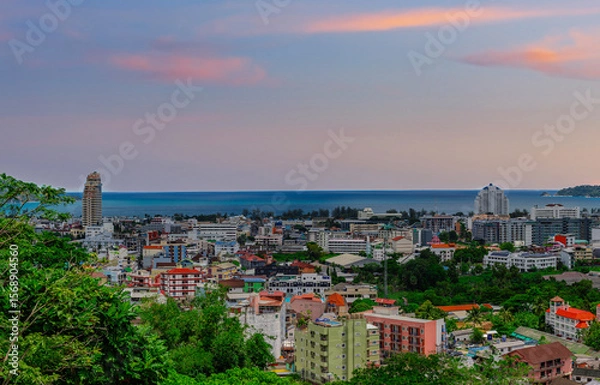 Fototapeta view of Patong and Patong Beach from the mountains colourful skies at Sunset. Patong is a vibrant city full of tourists from all around the world. 