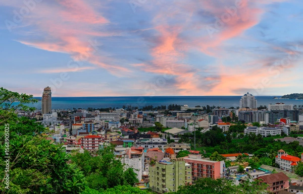 Fototapeta view of Patong and Patong Beach from the mountains colourful skies at Sunset. Patong is a vibrant city full of tourists from all around the world. 