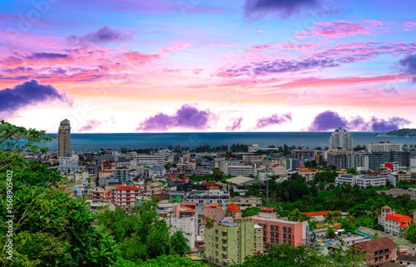 Fototapeta view of Patong and Patong Beach from the mountains colourful skies at Sunset. Patong is a vibrant city full of tourists from all around the world. 