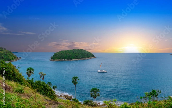 Fototapeta view of Patong and Patong Beach from the mountains colourful skies at Sunset. Patong is a vibrant city full of tourists from all around the world. 