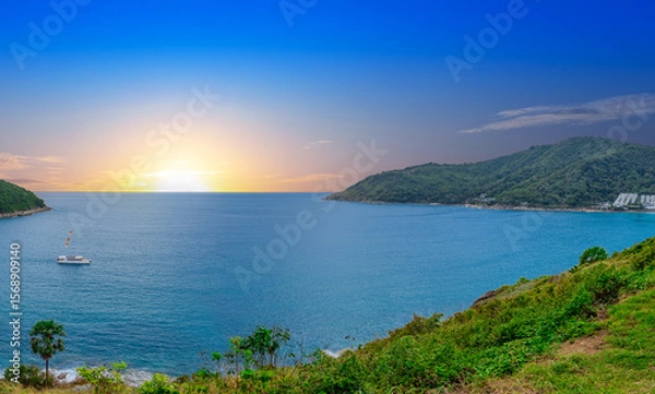 Fototapeta view of Patong and Patong Beach from the mountains colourful skies at Sunset. Patong is a vibrant city full of tourists from all around the world. 